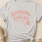 Hanging by a Thread But it's a Cute Thread T-Shirt