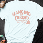 Hanging by a Thread But it's a Cute Thread T-Shirt